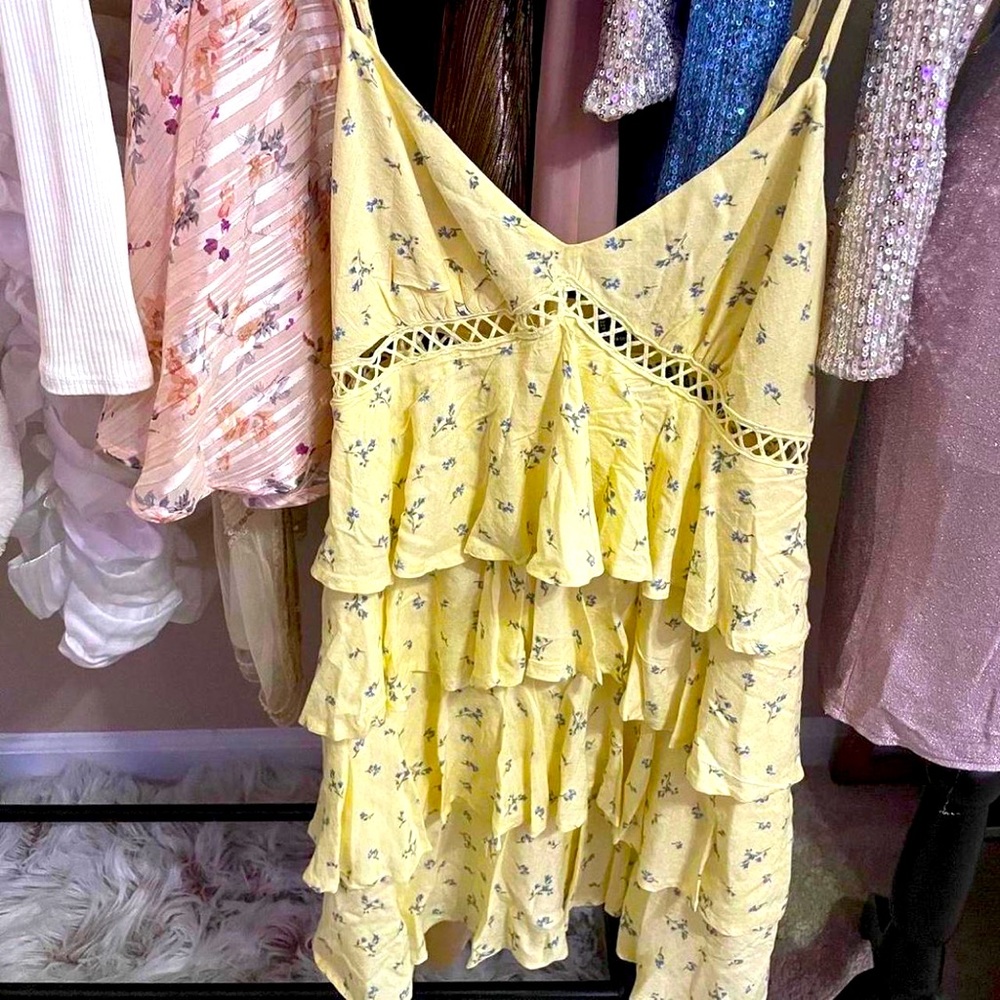 Adjustable spaghetti strap, ruffled, yellow, floral pattern, sundress.